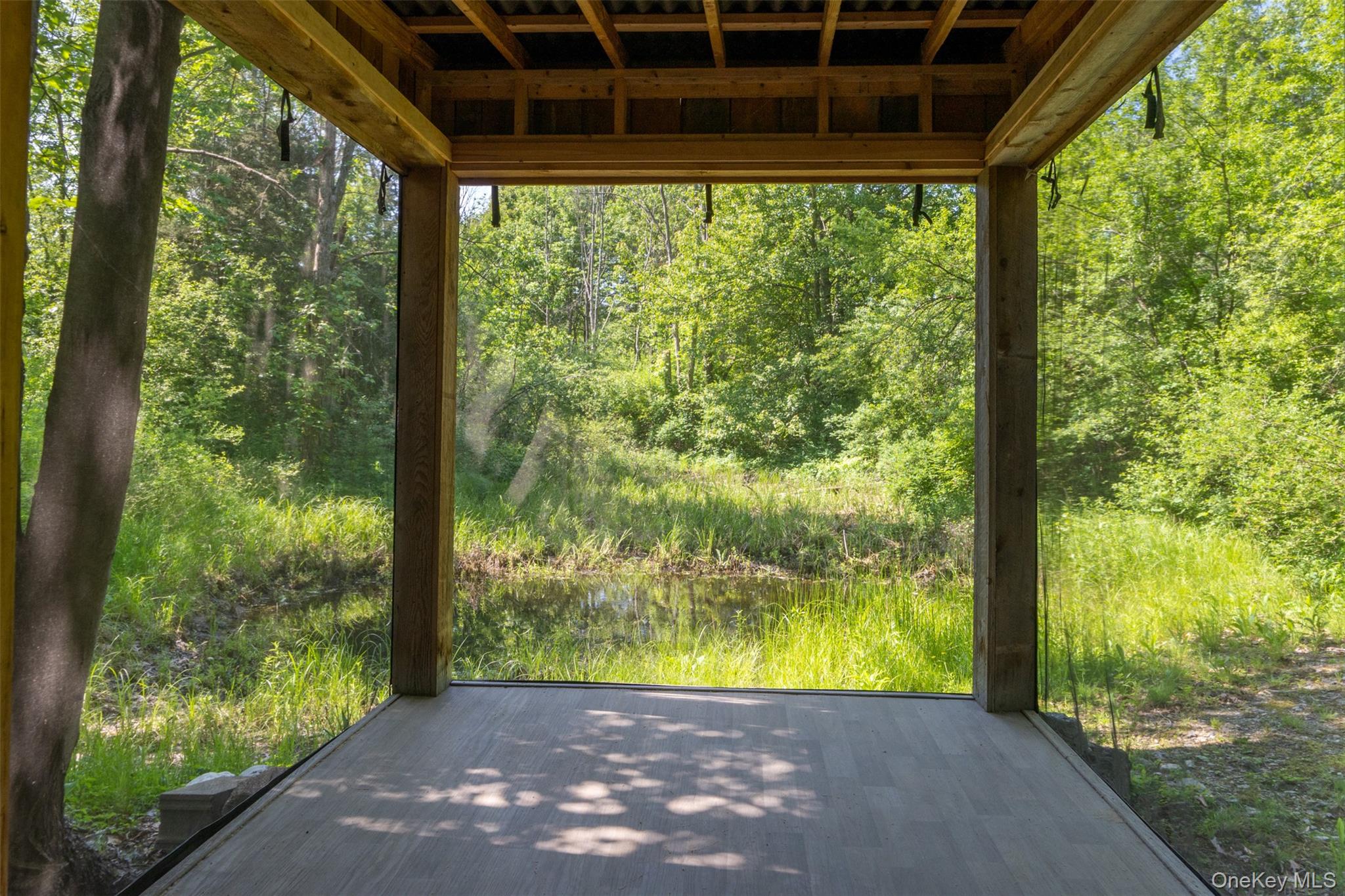 508 Woodstock Road Millbrook, NY 12545 - Photo 38 of 46 a view of a porch with a yard