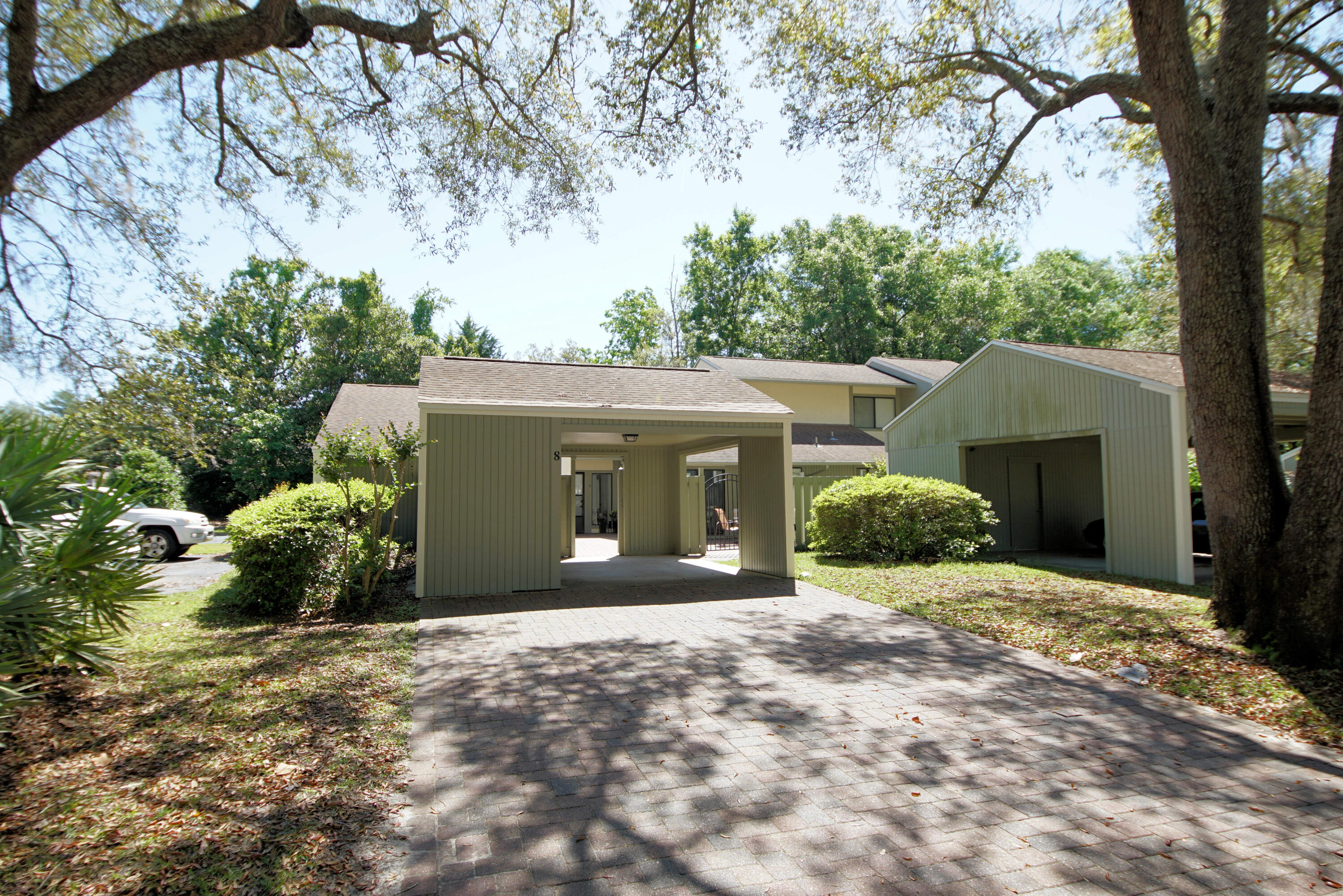 800 Bay Drive, Unit 8 Niceville, FL 32578 - Photo 13 of 29 front view of a house with a yard and potted plants
