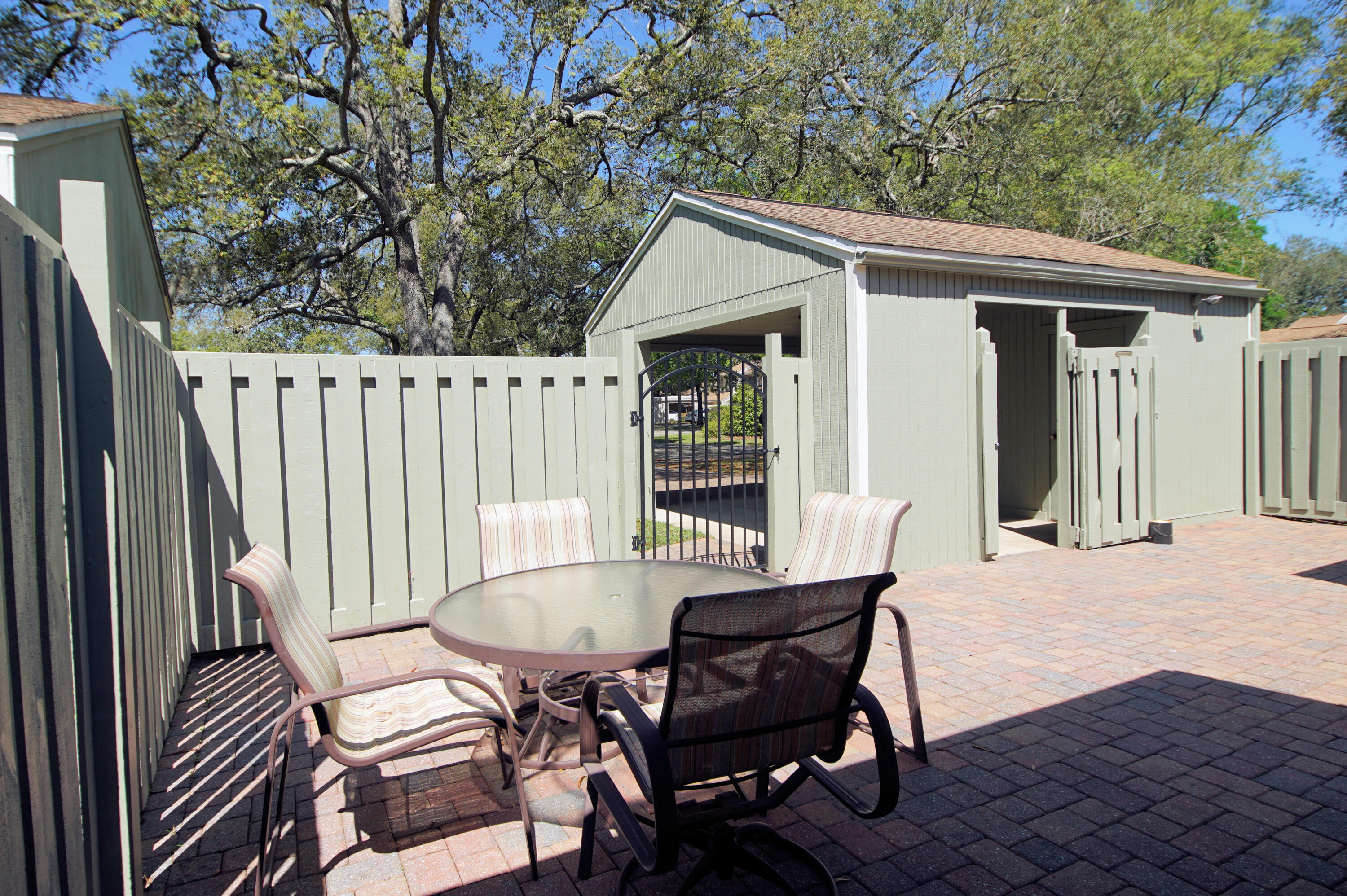 800 Bay Drive, Unit 8 Niceville, FL 32578 - Photo 15 of 29 a view of a patio with a table and chairs