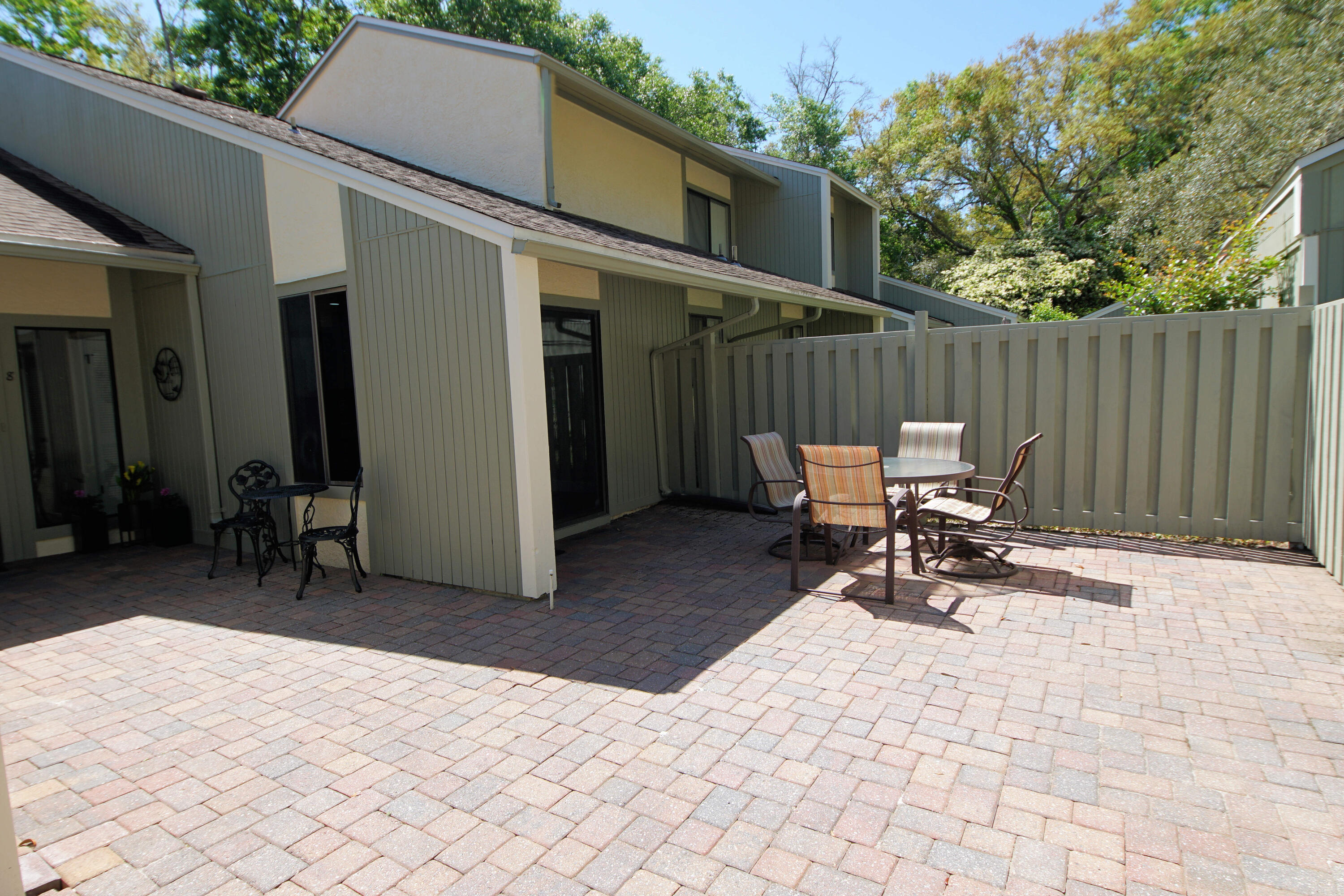 800 Bay Drive, Unit 8 Niceville, FL 32578 - Photo 16 of 29 a view of a patio with a table and chairs