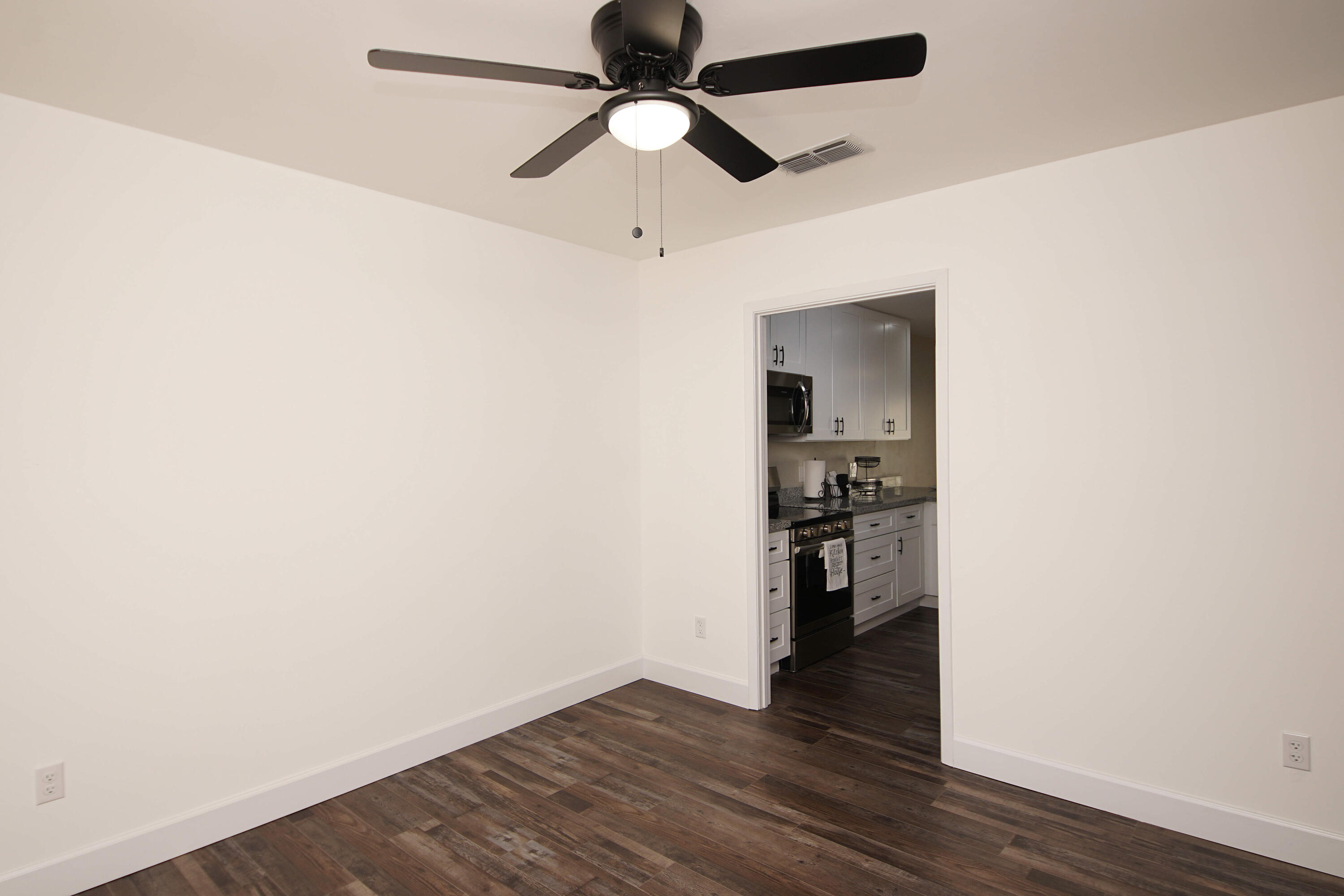 800 Bay Drive, Unit 8 Niceville, FL 32578 - Photo 20 of 29 a view of empty room with wooden floor