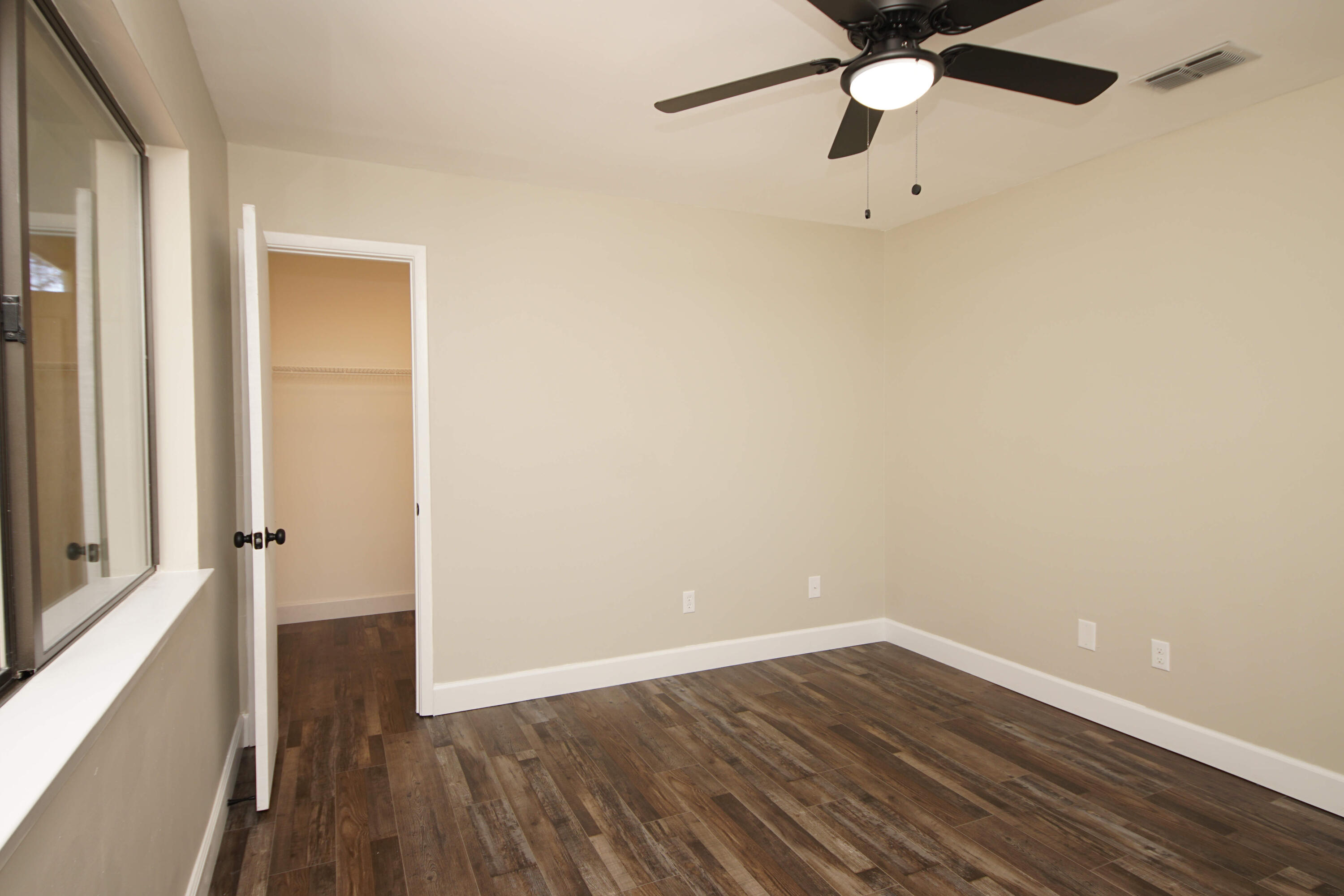 800 Bay Drive, Unit 8 Niceville, FL 32578 - Photo 26 of 29 a view of a room with wooden floor and white walls