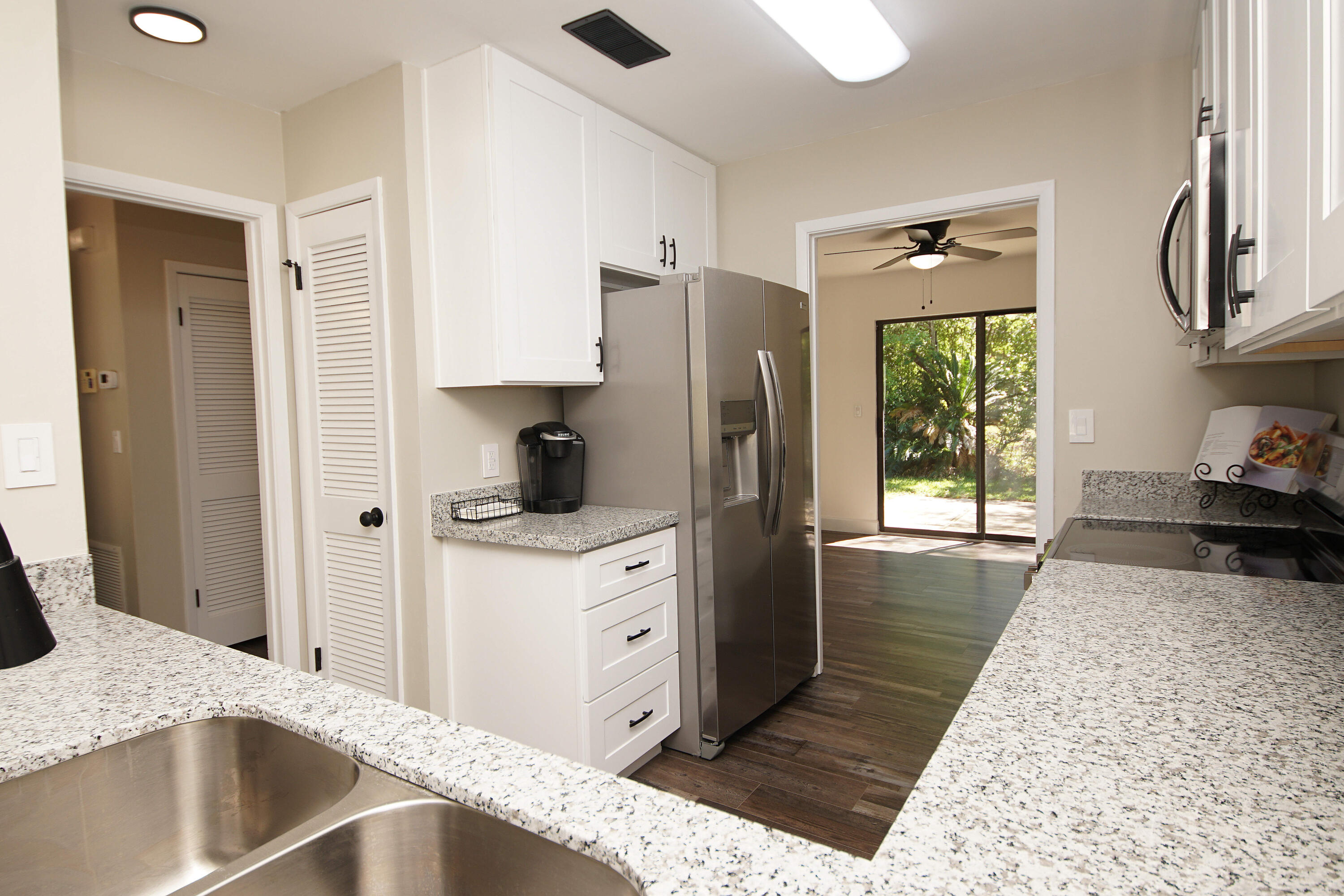 800 Bay Drive, Unit 8 Niceville, FL 32578 - Photo 3 of 29 a kitchen with stainless steel appliances granite countertop a refrigerator and a sink