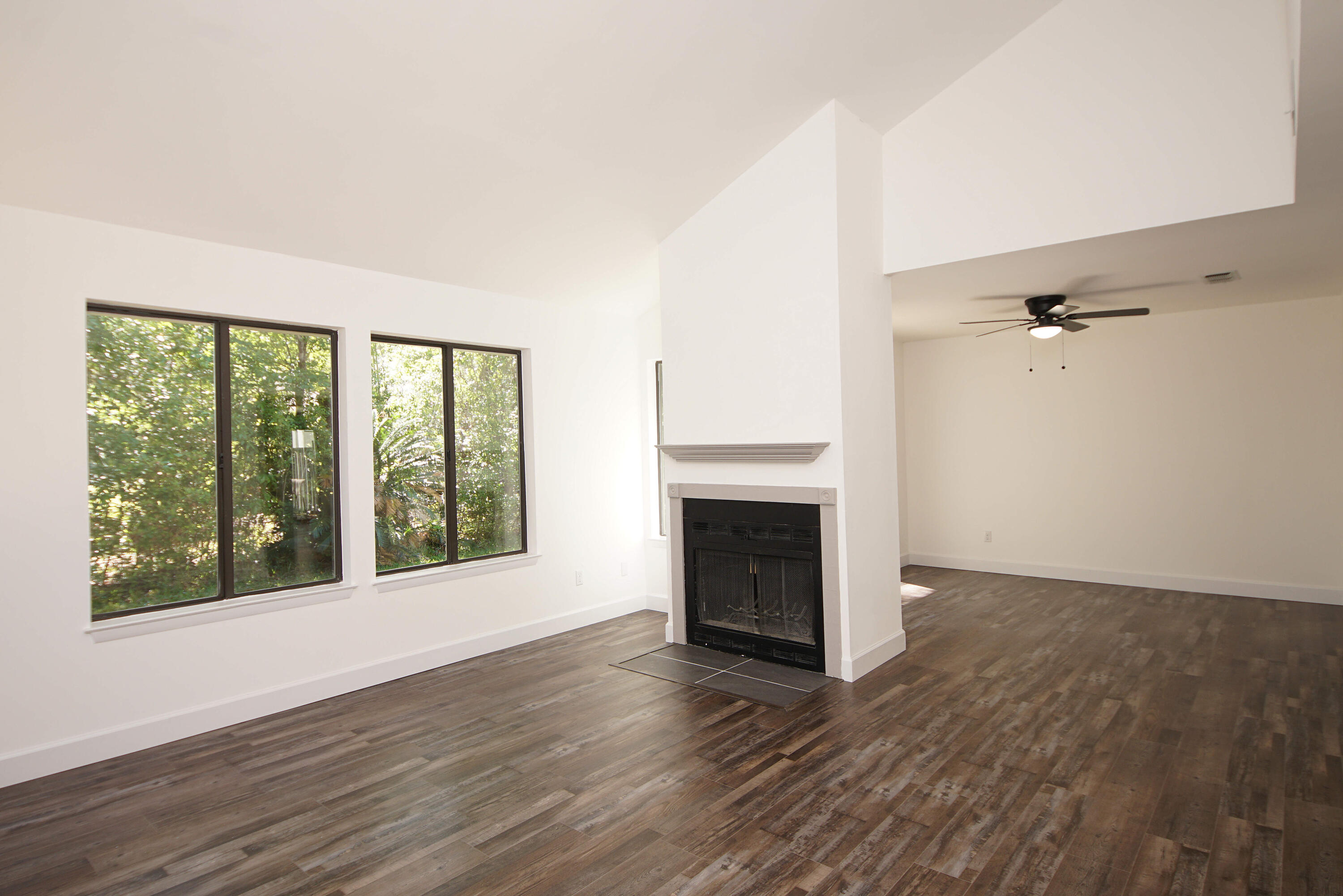 800 Bay Drive, Unit 8 Niceville, FL 32578 - Photo 7 of 29 wooden floor fireplace and natural light in room