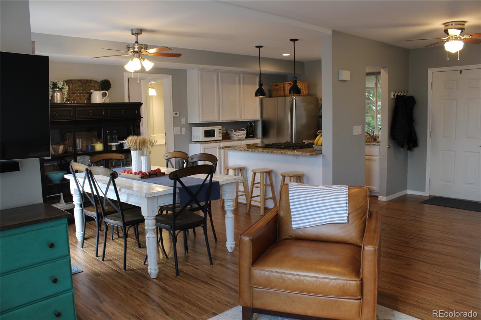 564 Alpine Road Dillon, CO 80435 - Photo 2 of 26 a dining room with furniture and a flat screen tv
