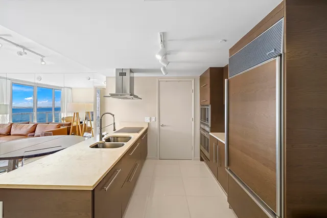 a kitchen with refrigerator and cabinets