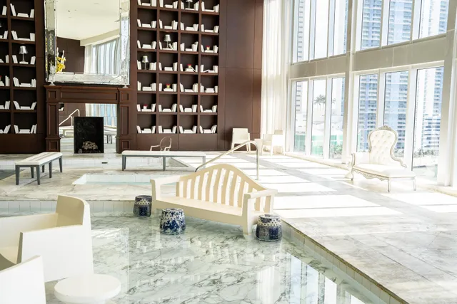 a living room filled with table and chairs