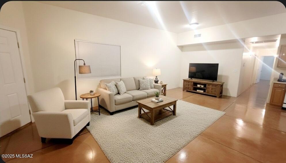 533 West San Xavier Road Tucson, AZ 85713 - Photo 18 of 21 a living room with furniture and a flat screen tv