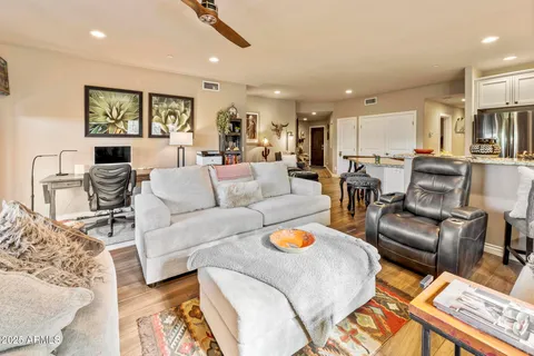 a living room with furniture and a large window