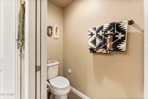 a white toilet sitting next to a bathroom sink