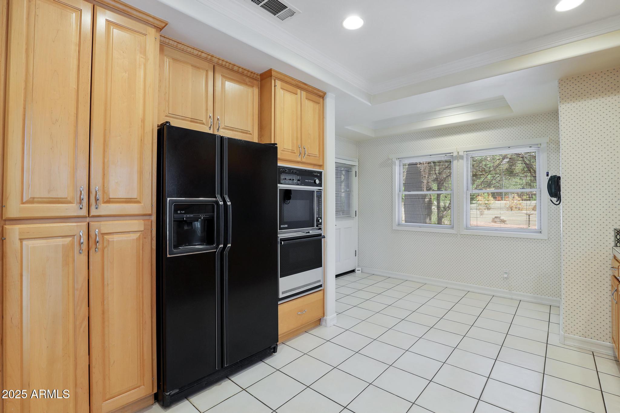 503 West Locust Road Payson, AZ 85541 - Photo 16 of 40 a kitchen with stainless steel appliances a refrigerator and a stove top oven