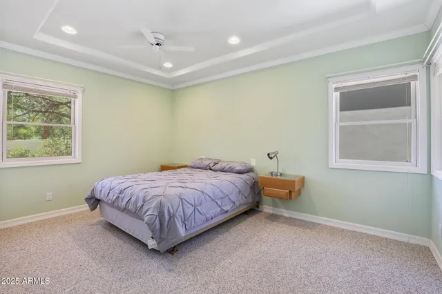 a bed room with a bed and a window