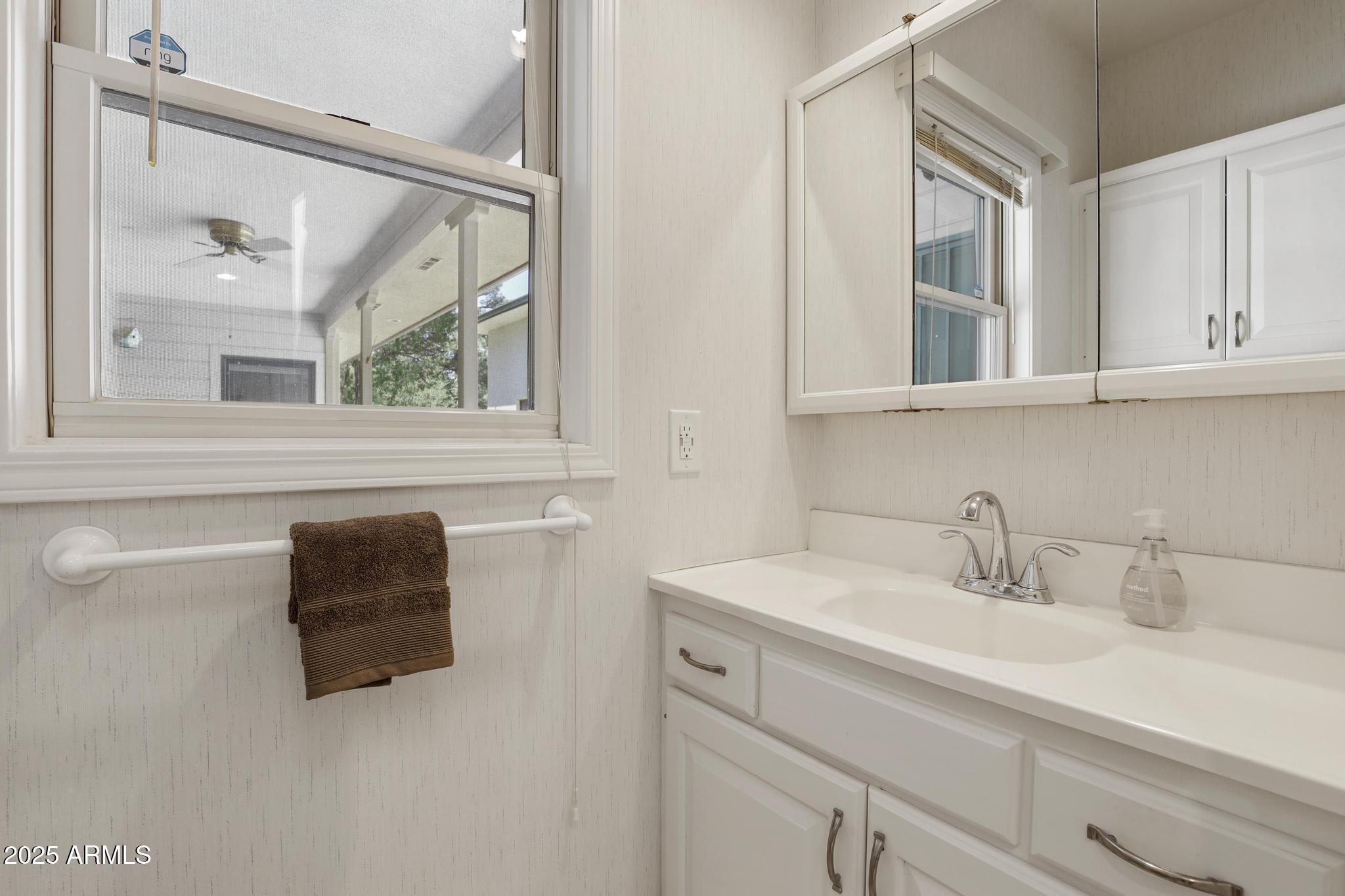 503 West Locust Road Payson, AZ 85541 - Photo 24 of 40 a bathroom with a sink and a mirror