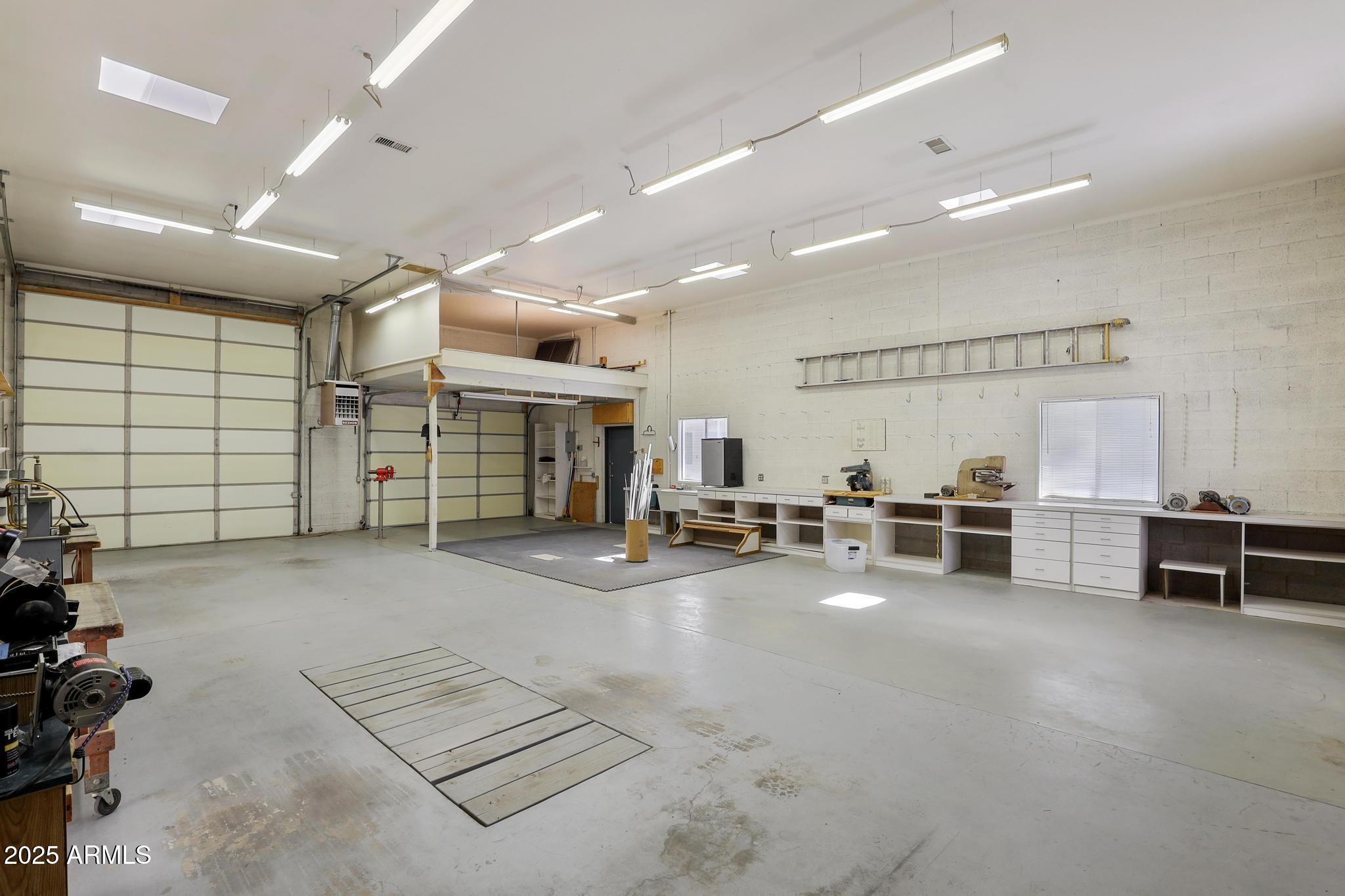 503 West Locust Road Payson, AZ 85541 - Photo 28 of 40 a view of a livingroom with gym equipment and a large window