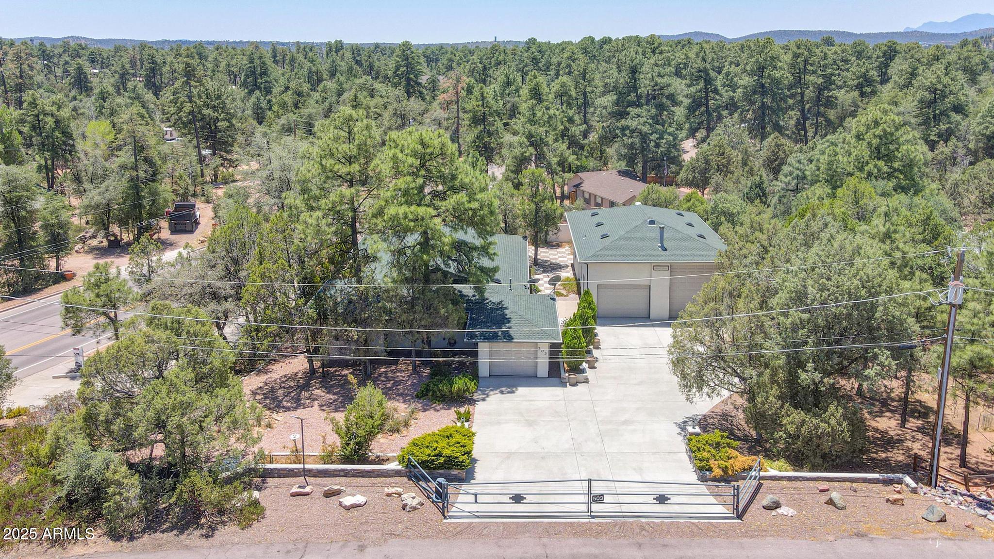 503 West Locust Road Payson, AZ 85541 - Photo 39 of 40 a view of a patio with table and chairs and potted plants