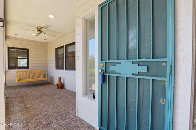 a view of a livingroom with furniture and staircase