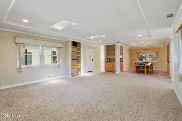 a view of a livingroom with furniture and a window