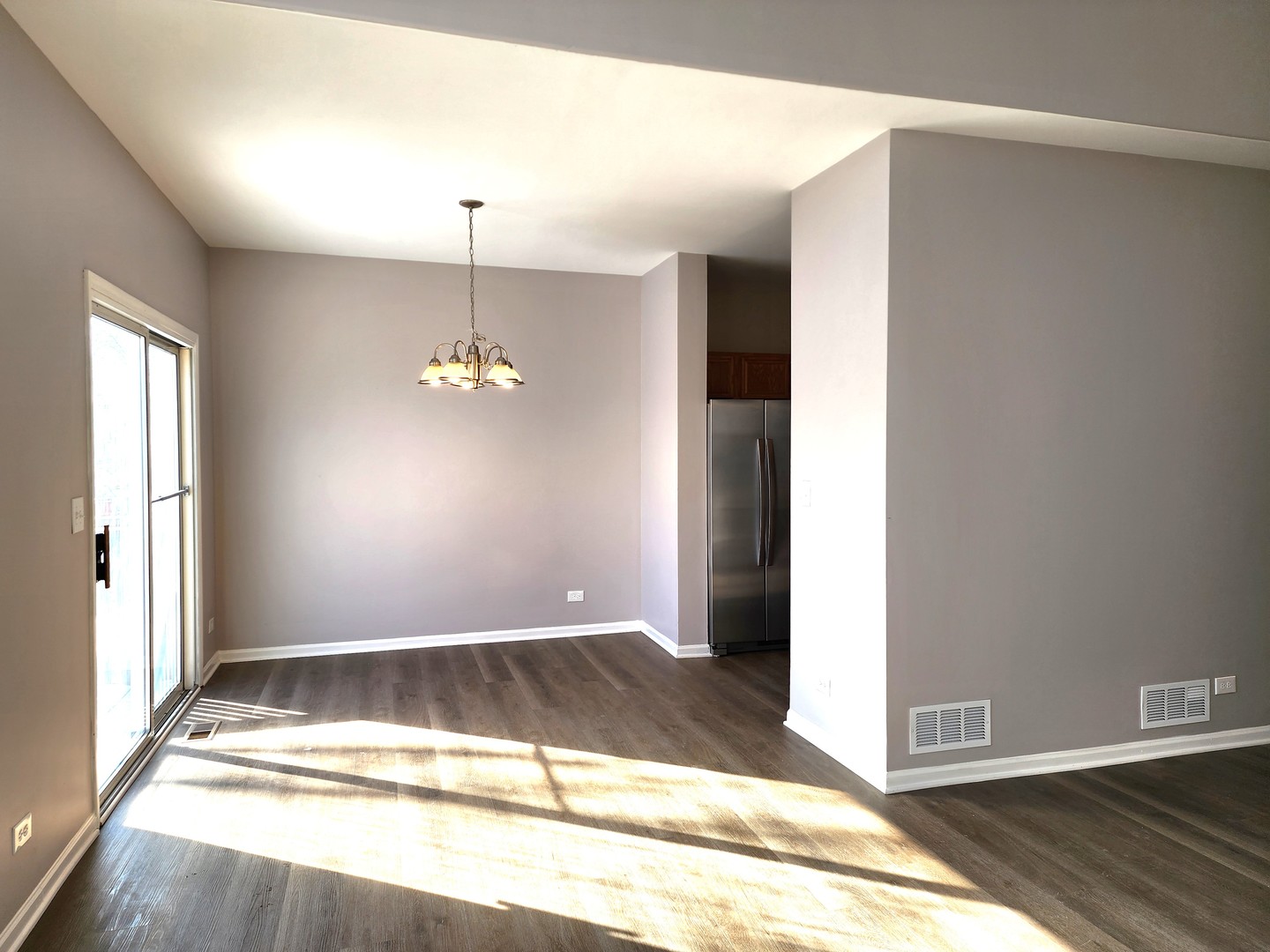 13 Brian Court Algonquin, IL 60102 - Photo 3 of 13 a view of a room with wooden floor and ceiling fan