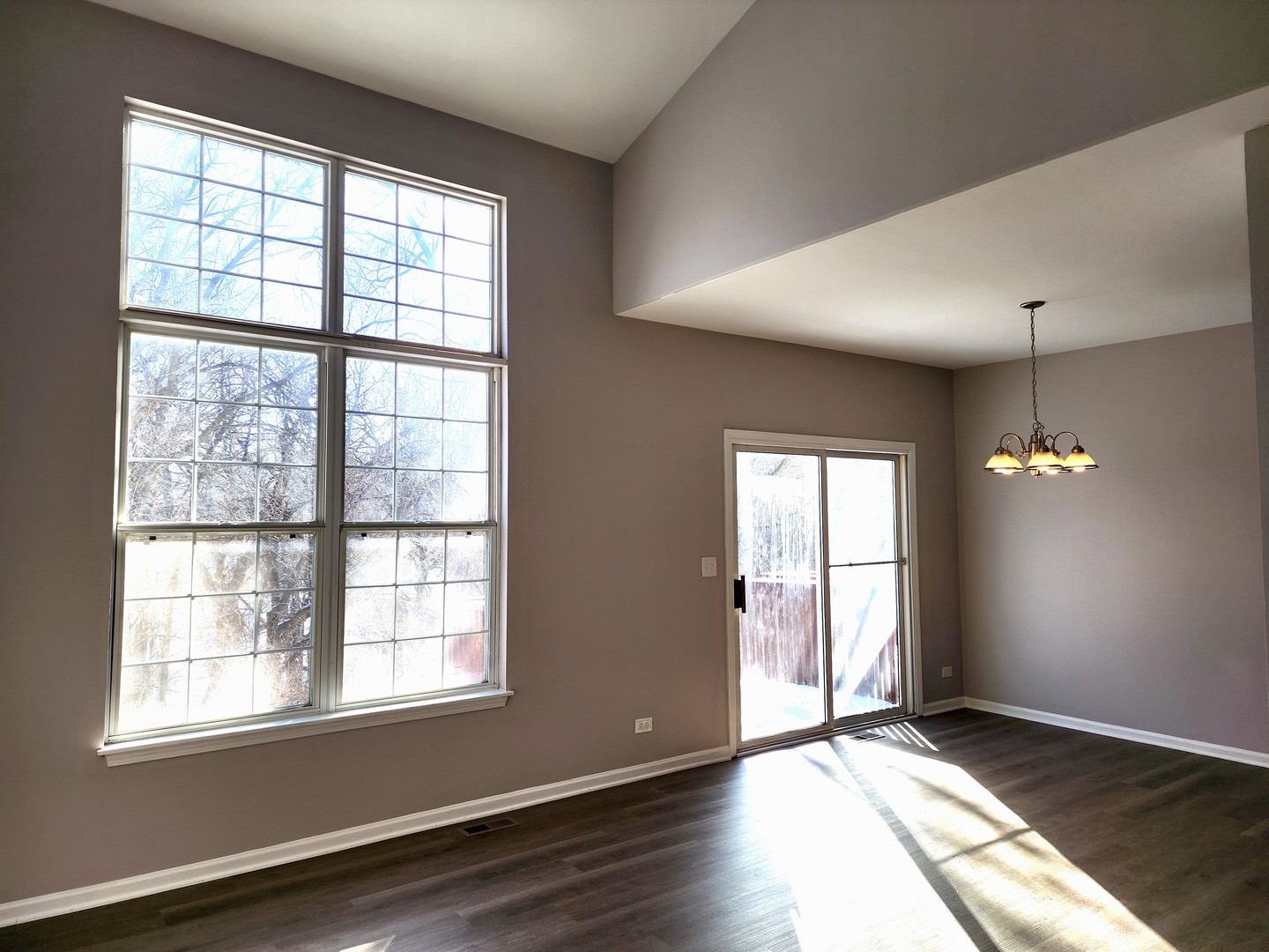 13 Brian Court Algonquin, IL 60102 - Photo 4 of 13 an empty room with wooden floor and windows