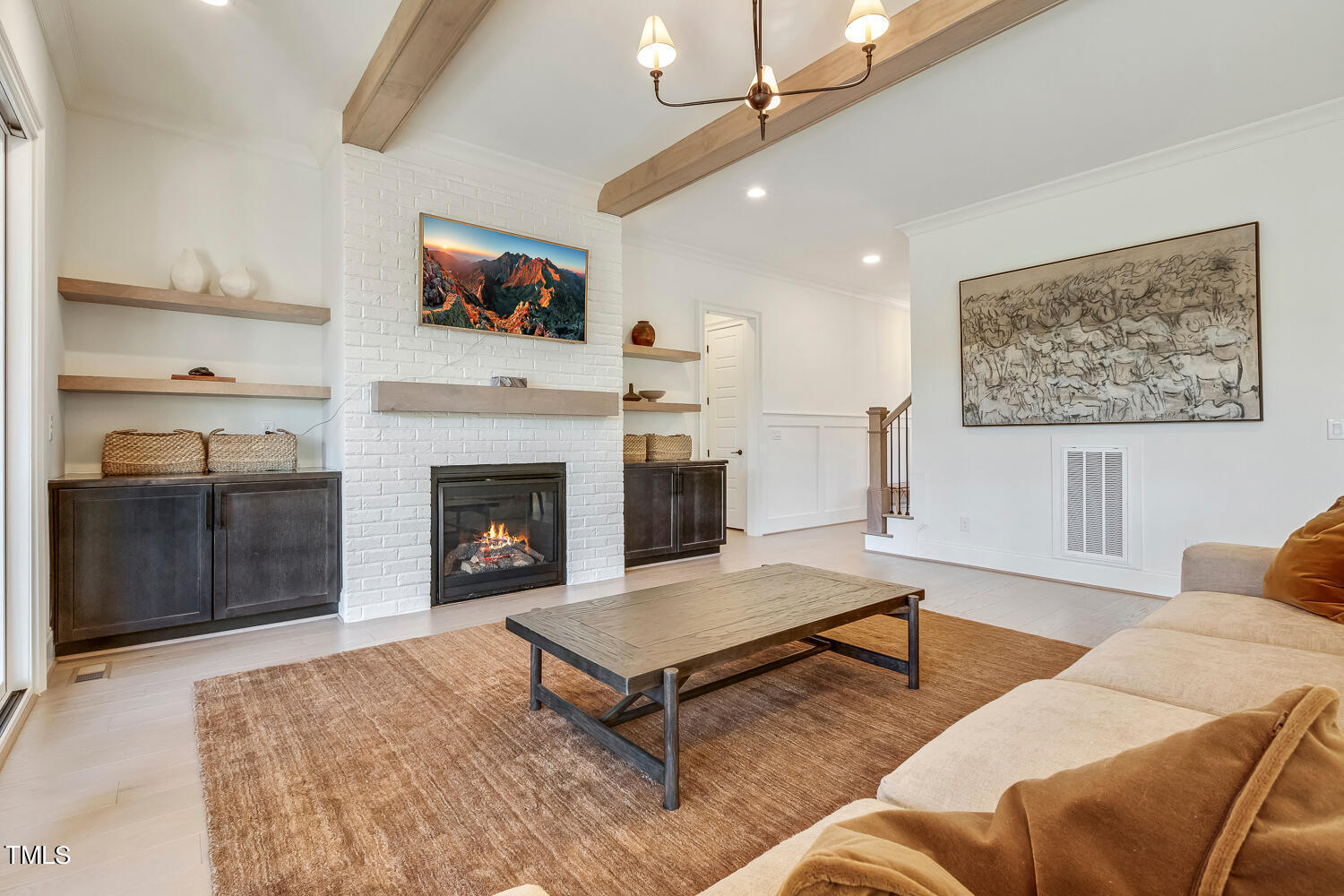 900 Harrison Ridge Road Wake Forest, NC 27587 - Photo 17 of 78 a living room with furniture a flat screen tv and a fireplace