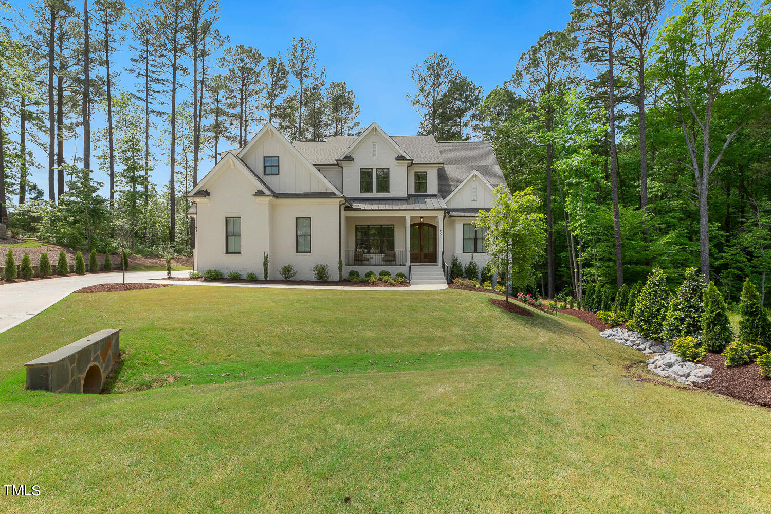 900 Harrison Ridge Road Wake Forest, NC 27587 - Photo 2 of 78 a front view of a house with garden