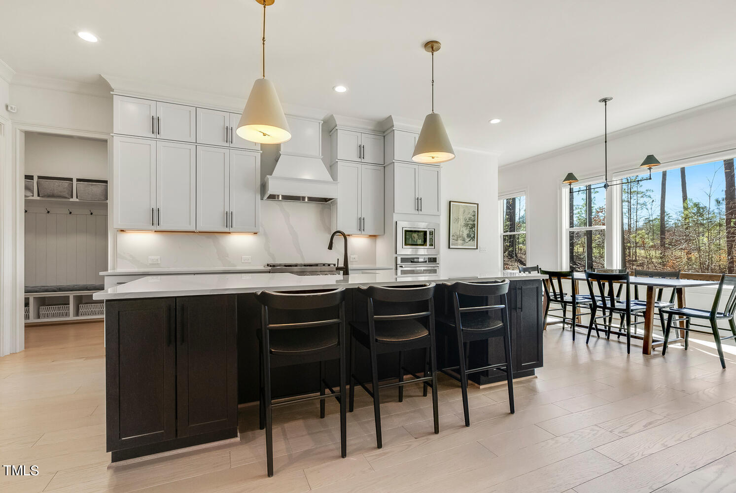 900 Harrison Ridge Road Wake Forest, NC 27587 - Photo 22 of 78 a kitchen with granite countertop a stove a sink a center island and chairs