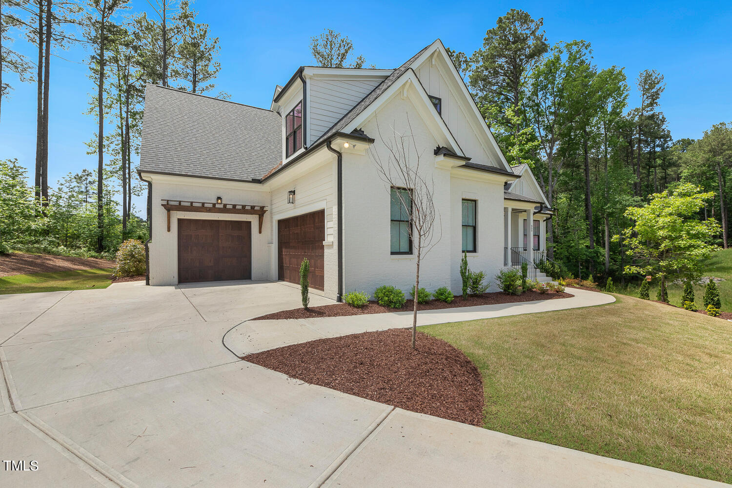 900 Harrison Ridge Road Wake Forest, NC 27587 - Photo 3 of 78 a view of a white house with a yard and large tree