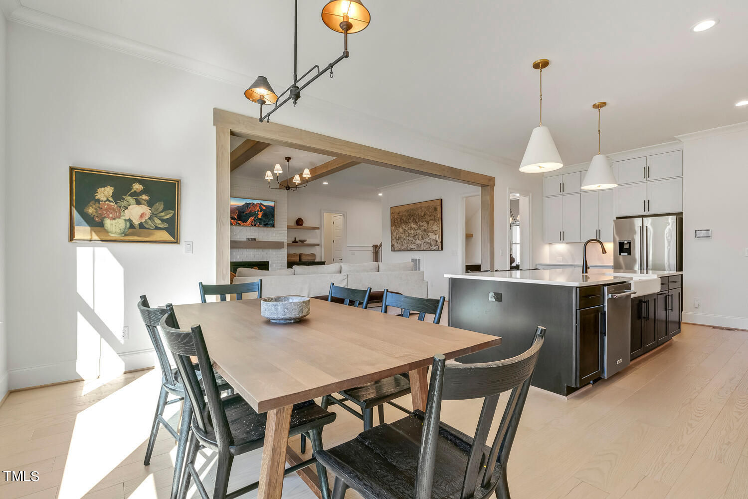 900 Harrison Ridge Road Wake Forest, NC 27587 - Photo 35 of 78 a view of a dining room and livingroom with furniture wooden floor a chandelier