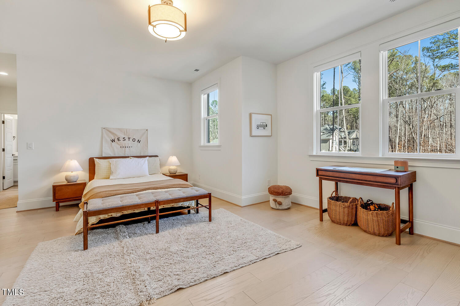 900 Harrison Ridge Road Wake Forest, NC 27587 - Photo 53 of 78 a living room with furniture a window and a table