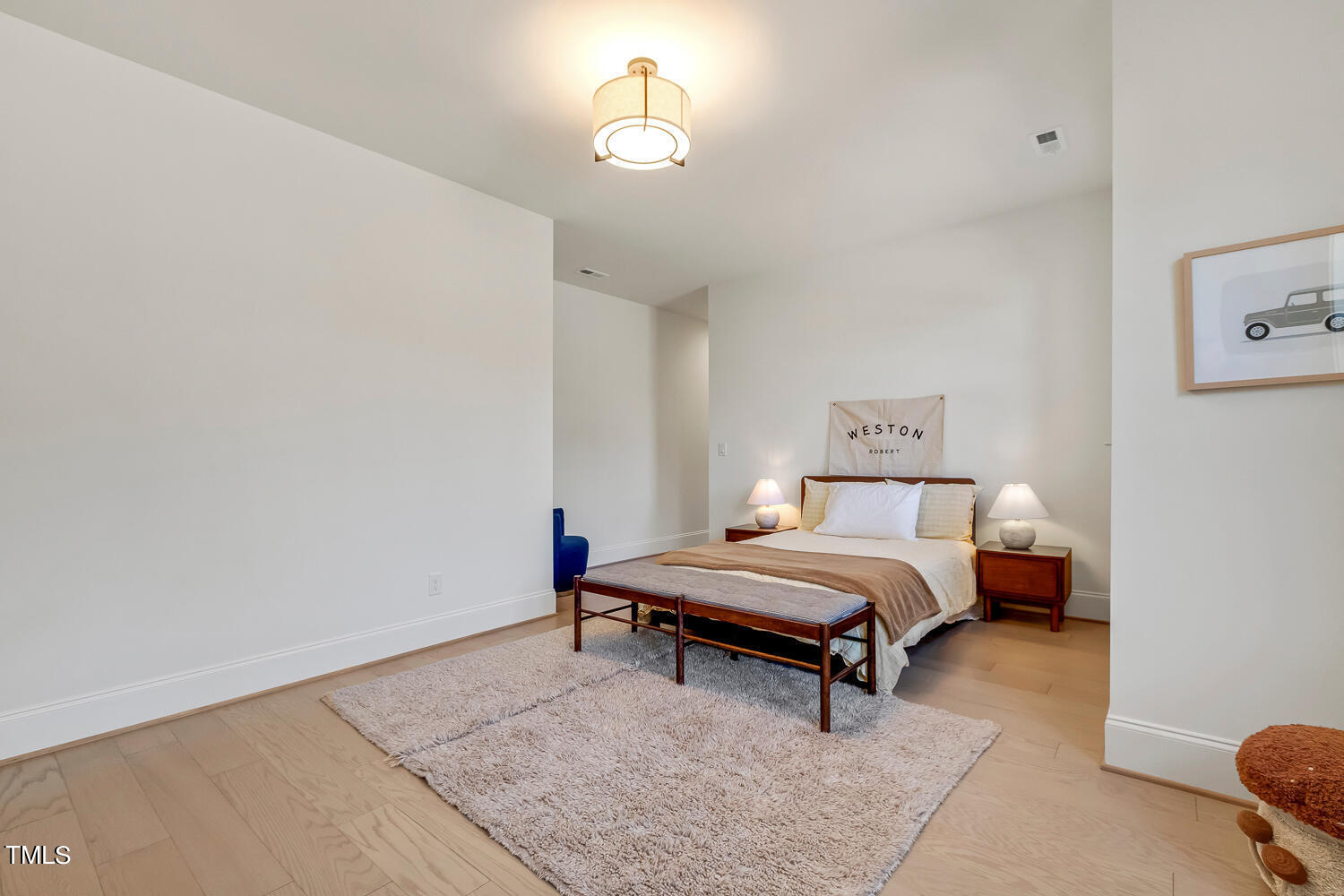900 Harrison Ridge Road Wake Forest, NC 27587 - Photo 54 of 78 a living room with a bed furniture and a lamp