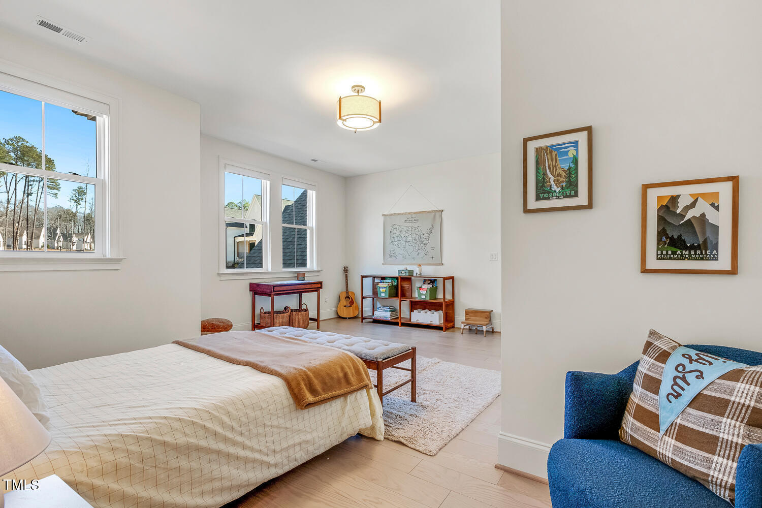 900 Harrison Ridge Road Wake Forest, NC 27587 - Photo 56 of 78 a bedroom with furniture and a chandelier
