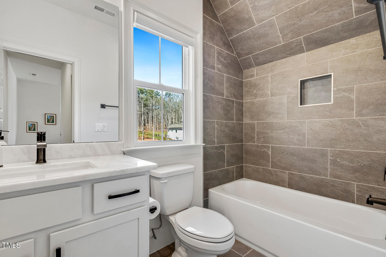 900 Harrison Ridge Road Wake Forest, NC 27587 - Photo 57 of 78 a bathroom with a sink a toilet and shower
