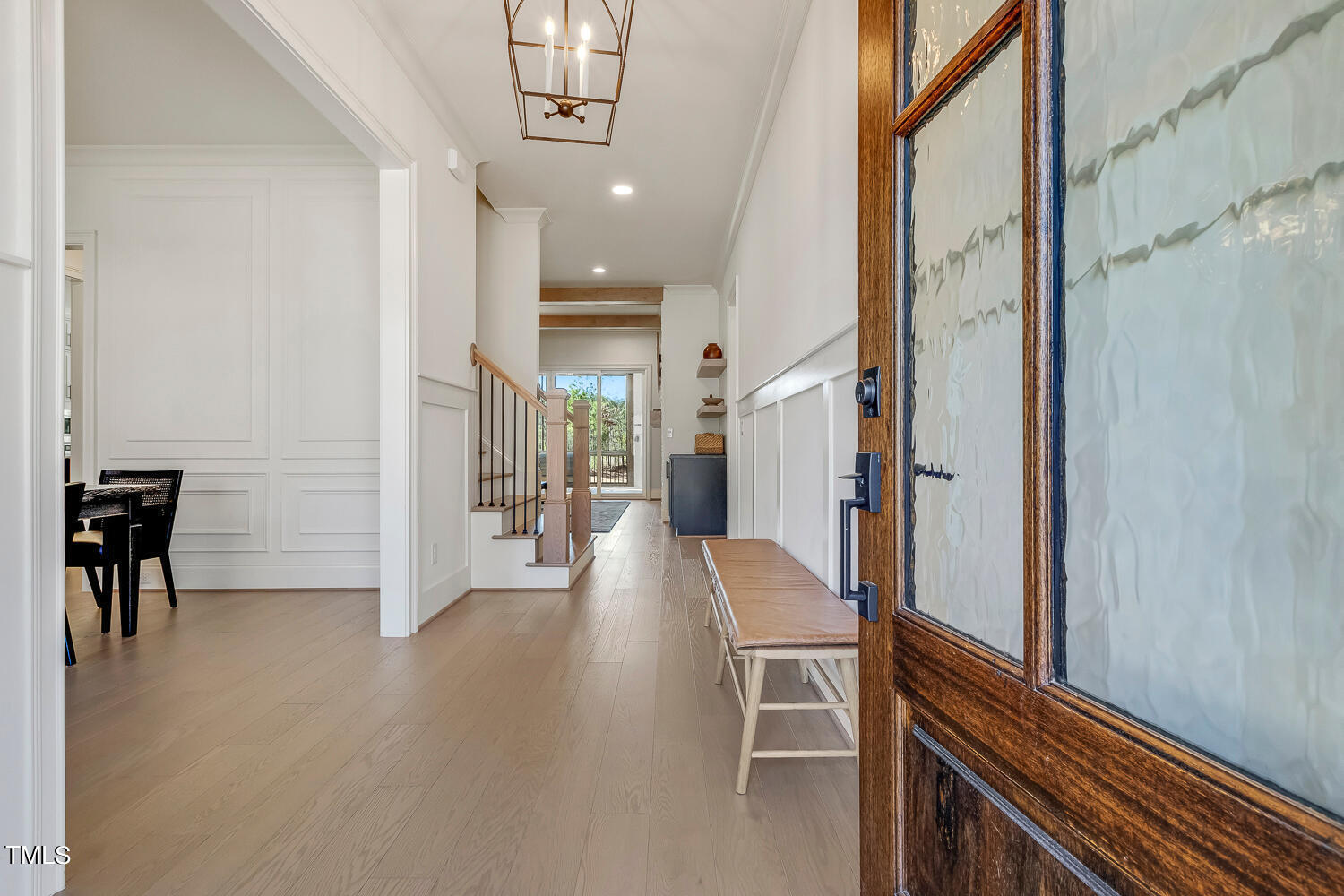 900 Harrison Ridge Road Wake Forest, NC 27587 - Photo 6 of 78 a view of a hallway with furniture and a chandelier