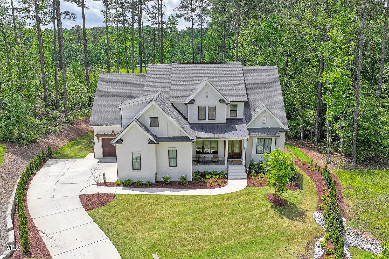 900 Harrison Ridge Road Wake Forest, NC 27587 - Photo 72 of 78 a aerial view of a house with swimming pool lawn chairs and a small yard