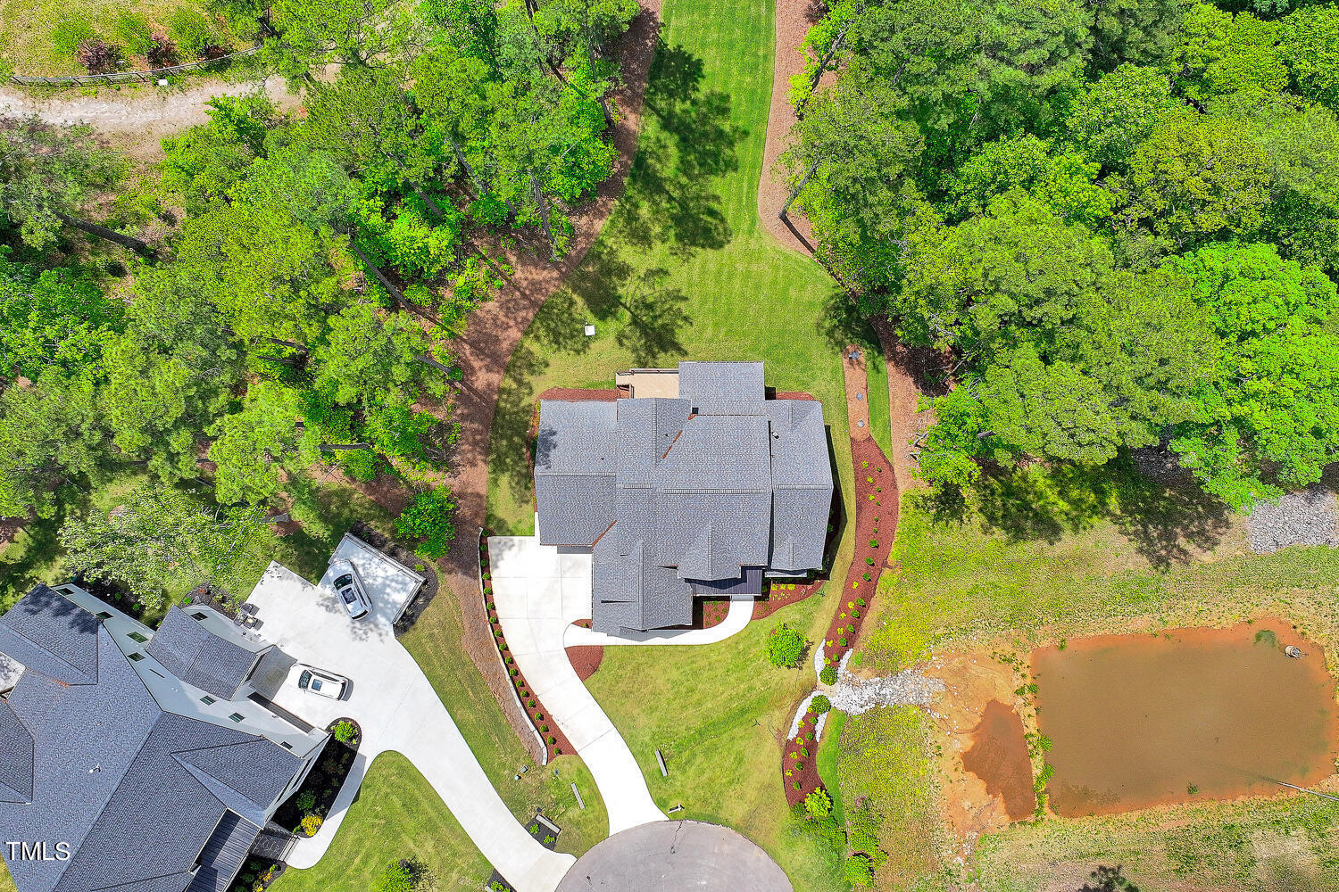 900 Harrison Ridge Road Wake Forest, NC 27587 - Photo 76 of 78 an aerial view of a house with swimming pool and large trees