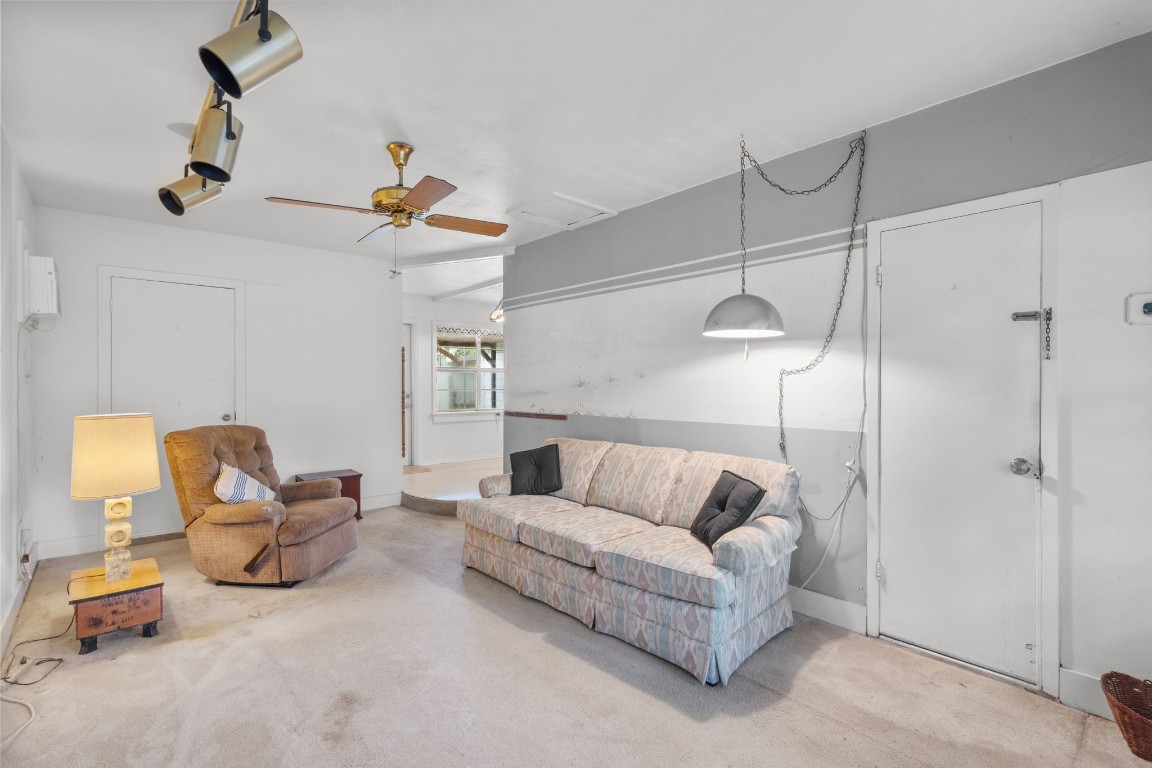 1126 Orange Street La Marque, TX 77568 - Photo 17 of 36 a living room with furniture and a chandelier