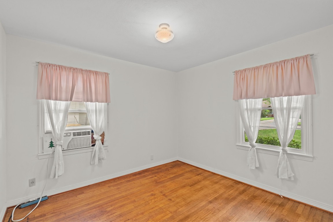 1126 Orange Street La Marque, TX 77568 - Photo 19 of 36 a view of a room with wooden floor and window