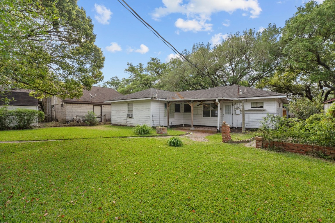 1126 Orange Street La Marque, TX 77568 - Photo 33 of 36 a front view of house with a garden and porch