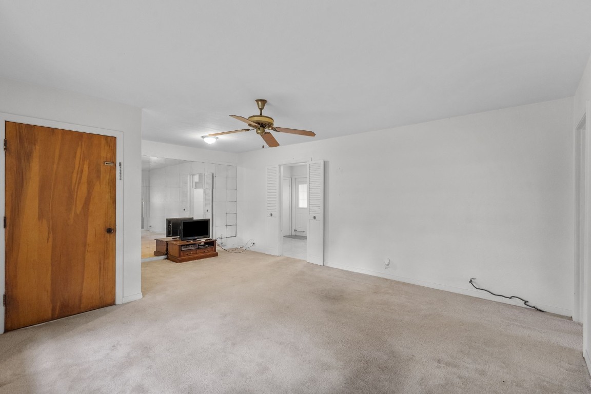 1126 Orange Street La Marque, TX 77568 - Photo 8 of 36 a view of empty room with a fireplace and fan