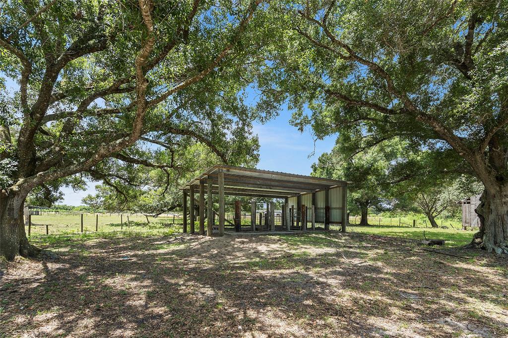 10100 West Midway Road Fort Pierce, FL 34945 - Photo 7 of 15 a front view of a house with a yard