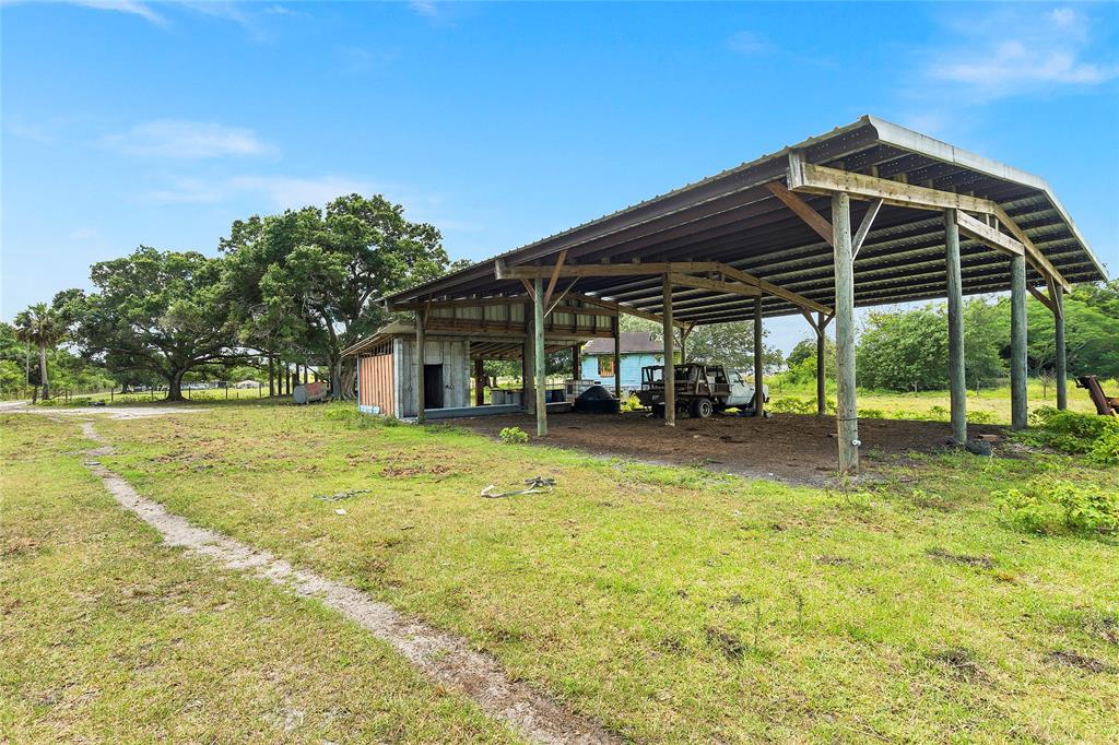 10100 West Midway Road Fort Pierce, FL 34945 - Photo 8 of 15 a view of a house with swimming pool