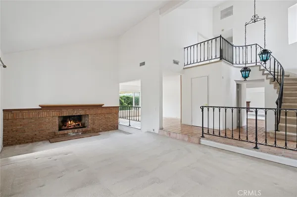 a view of an empty room with a fireplace