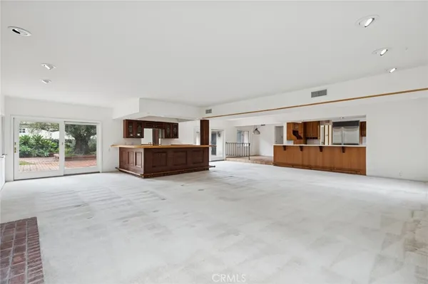 a big room with closet and windows