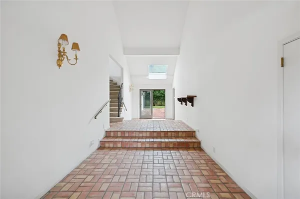 a view of a hallway with windows