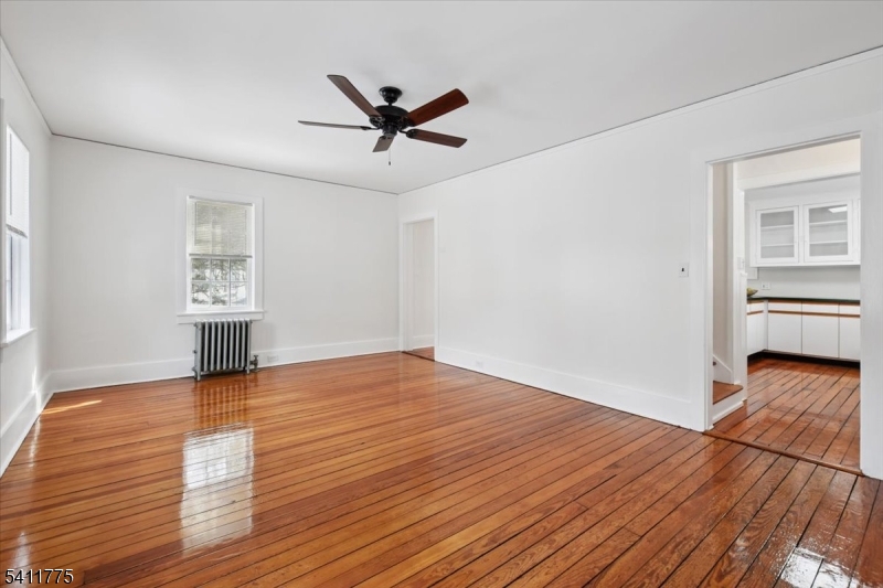 247 Liberty Corner Road Far Hills, NJ 07931 - Photo 8 of 18 a view of empty room with wooden floor and window