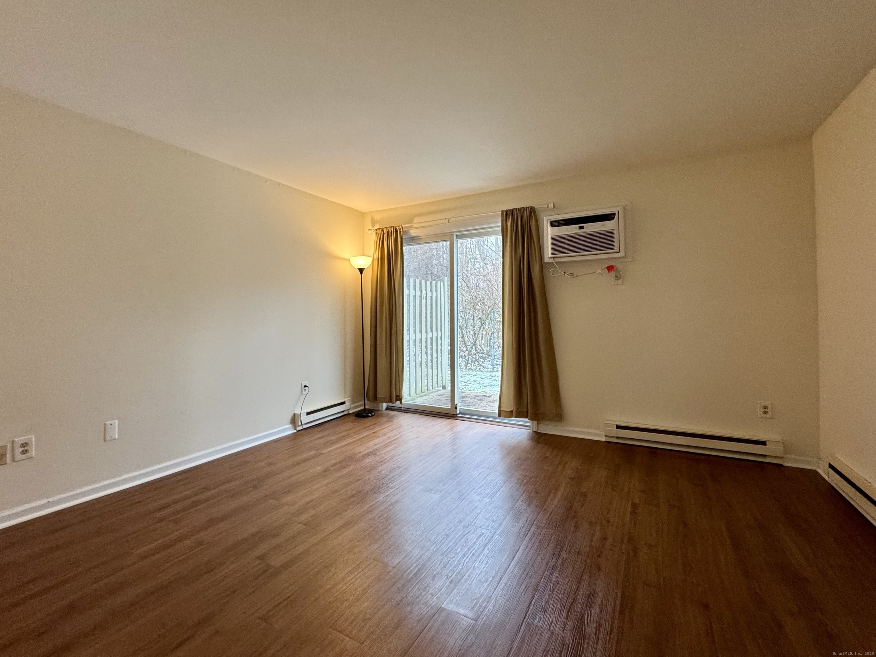 136 Pembroke Road, Unit 11101 Danbury, CT 06811 - Photo 12 of 17 an empty room with wooden floor and closet