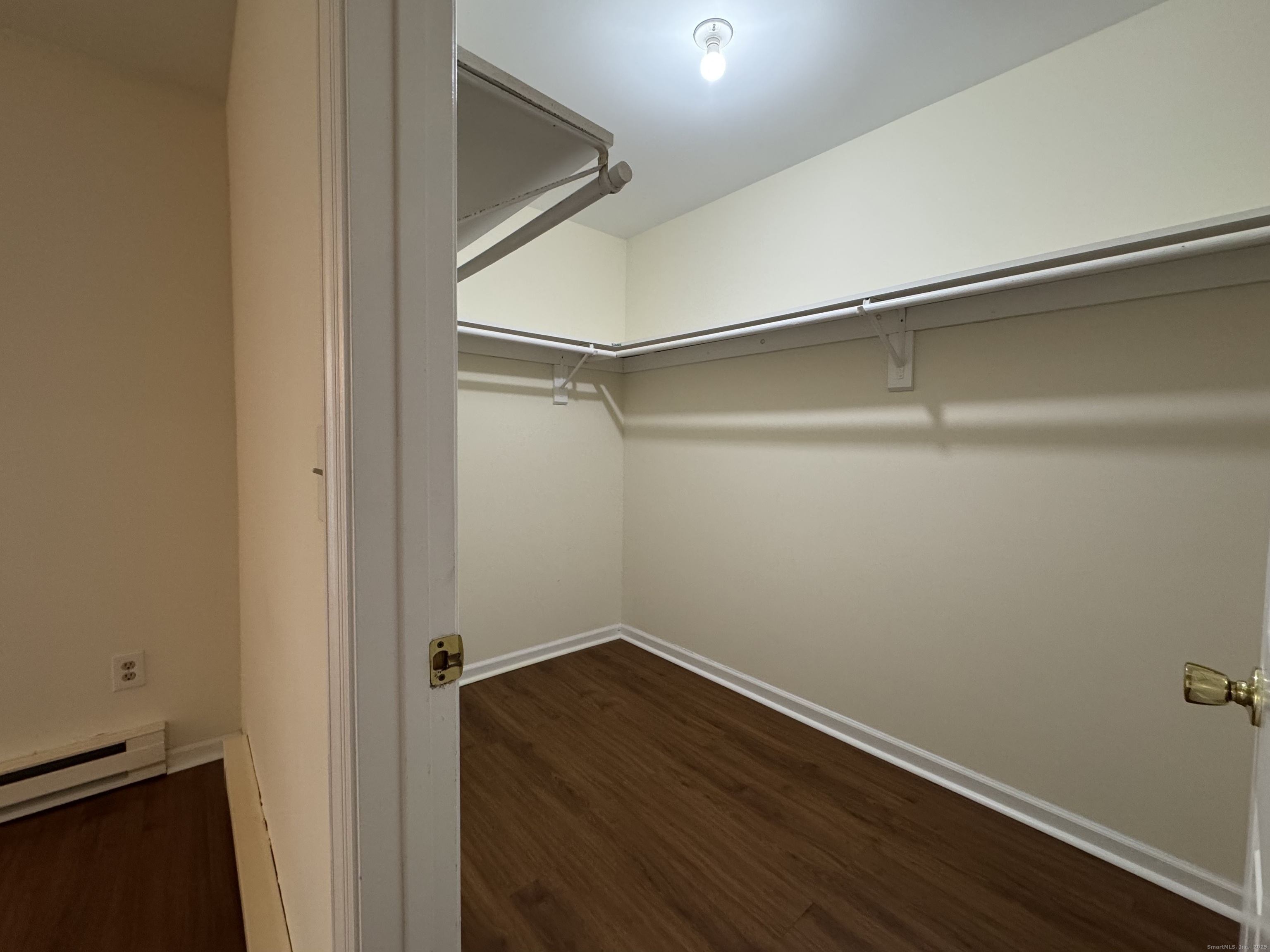 136 Pembroke Road, Unit 11101 Danbury, CT 06811 - Photo 13 of 17 a view of a room with wooden floor