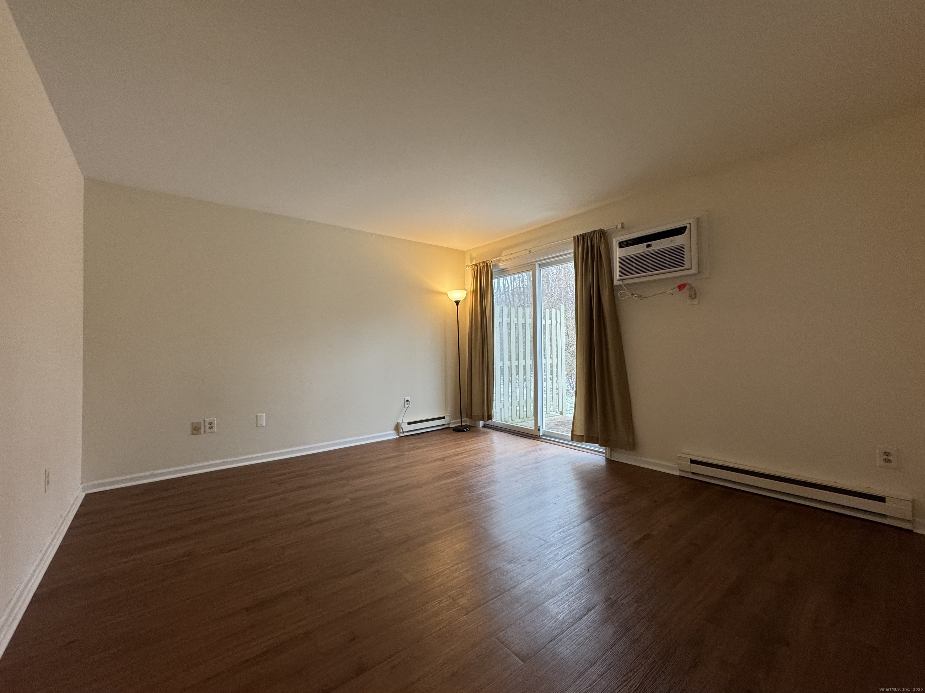 136 Pembroke Road, Unit 11101 Danbury, CT 06811 - Photo 15 of 17 an empty room with wooden floor
