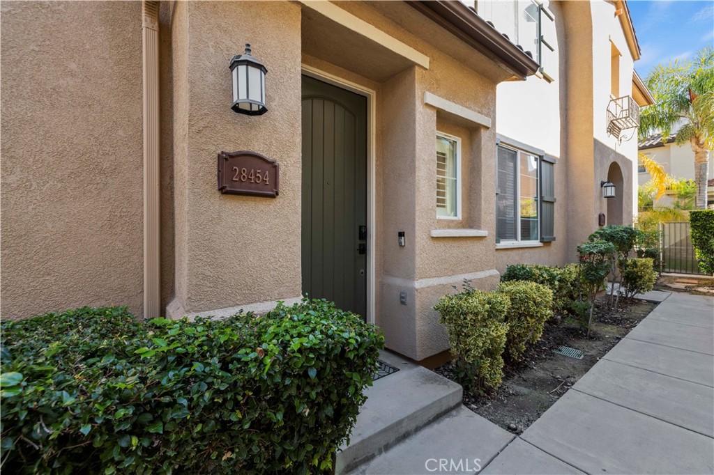 28454 Santa Rosa Lane Saugus, CA 91350 - Photo 3 of 36 a view of a bunch of flowers in front of a house