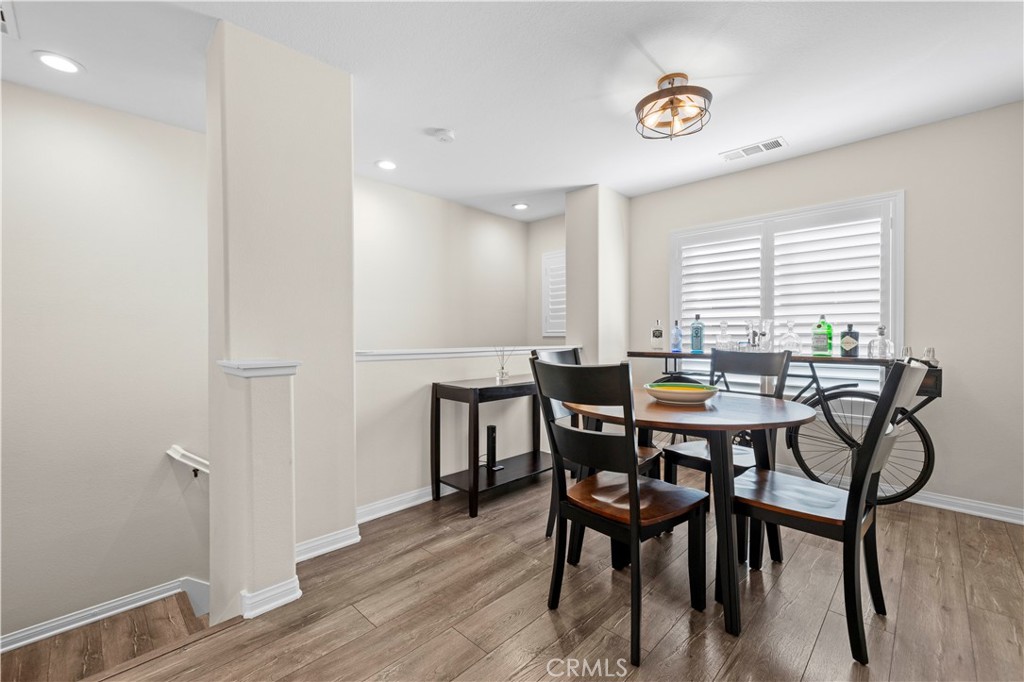 28454 Santa Rosa Lane Saugus, CA 91350 - Photo 4 of 36 a view of a a dining room with furniture window and wooden floor